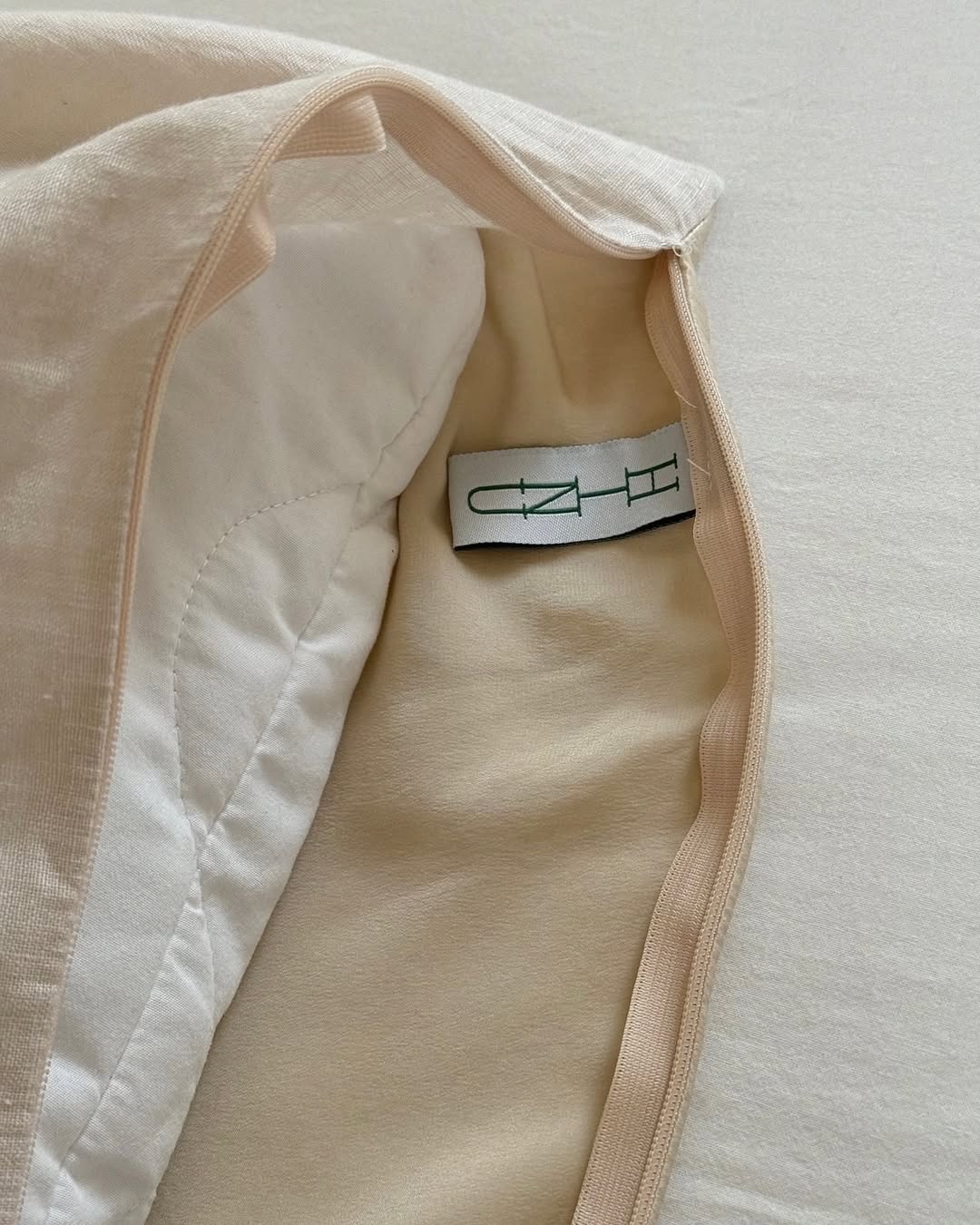 A tactile HINU fabric pouch detail