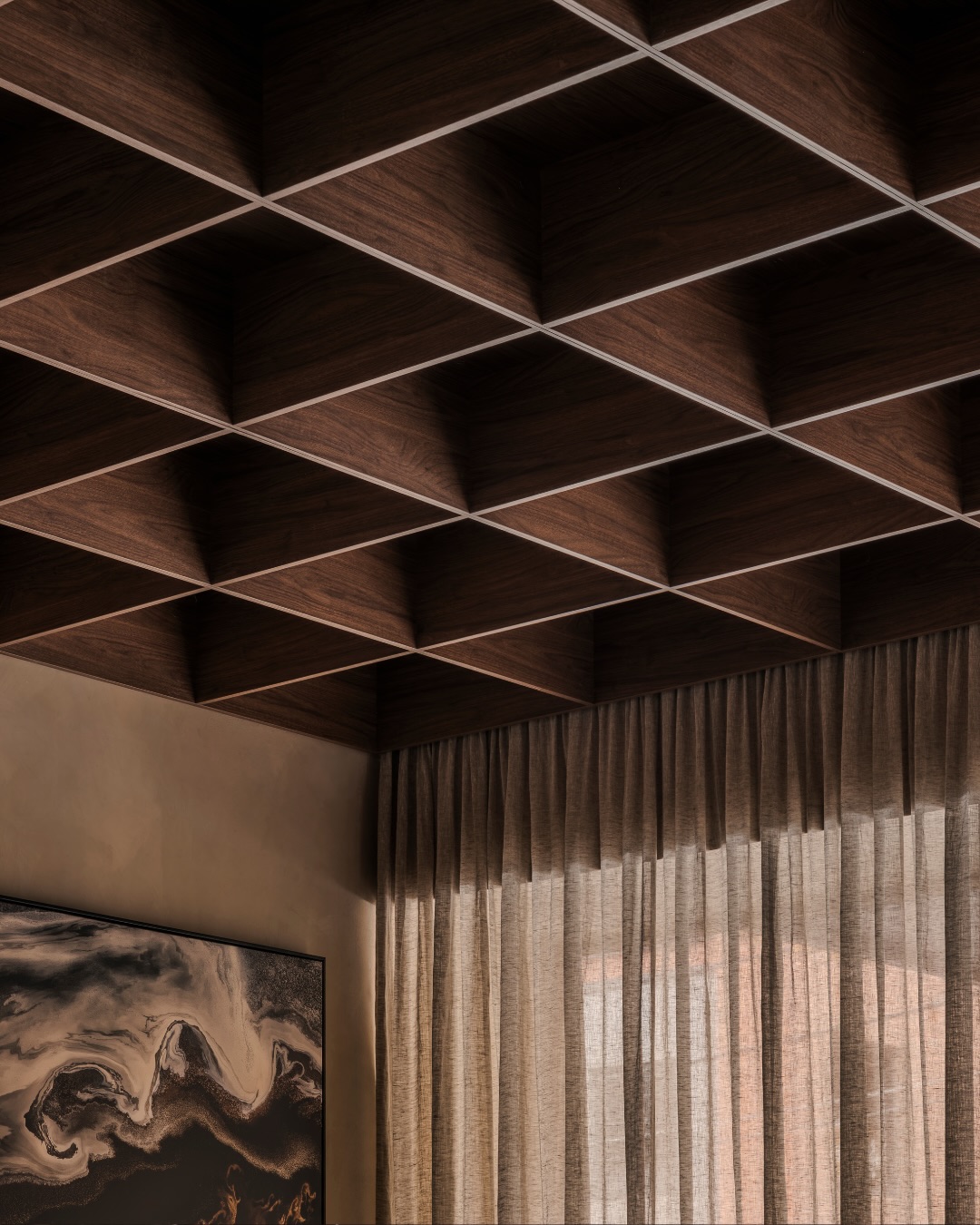 Walnut ceiling, artwork and filtered light inside our Brighton sanctuary